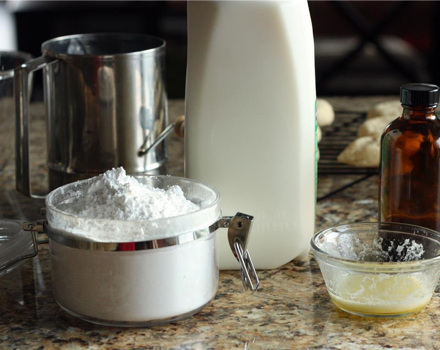 step 9 For the icing, melt the Unsalted Butter (1 oz). Sift Powdered Confectioners Sugar (1 1/4 cups) into a small bowl. Add melted butter, Vanilla Extract (1/2 tsp), Milk (2 Tbsp), and a couple drops of green Green Food Coloring Gel (to taste) and whisk together.