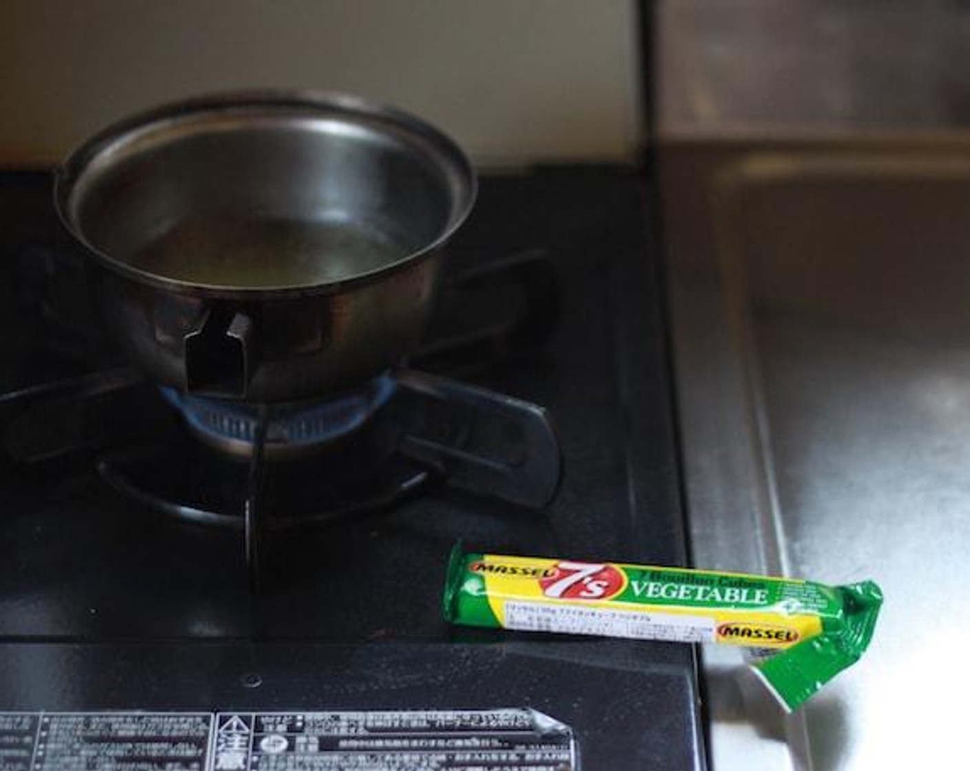 step 3 Put 2/3 cup of water and Vegetable Stock (2/3 cup) in a pot with lower heat for 5-7 minutes.