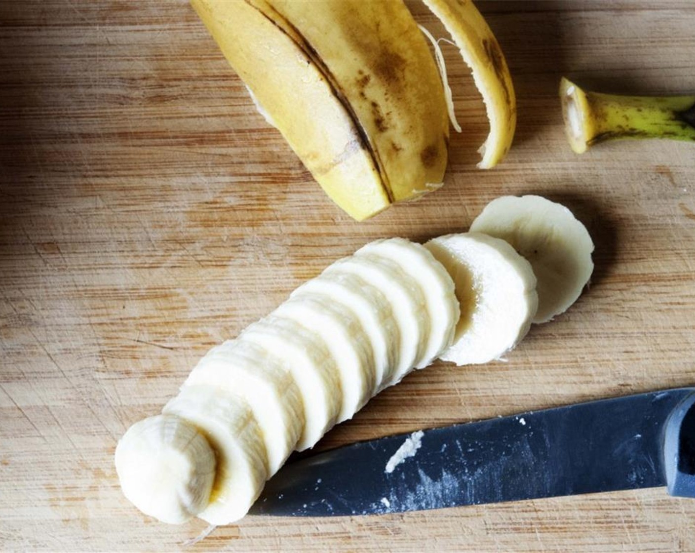 step 1 Melt the Unsalted Butter (4 Tbsp) then let it cool. Peel and slice up half of the ripe Bananas (2).