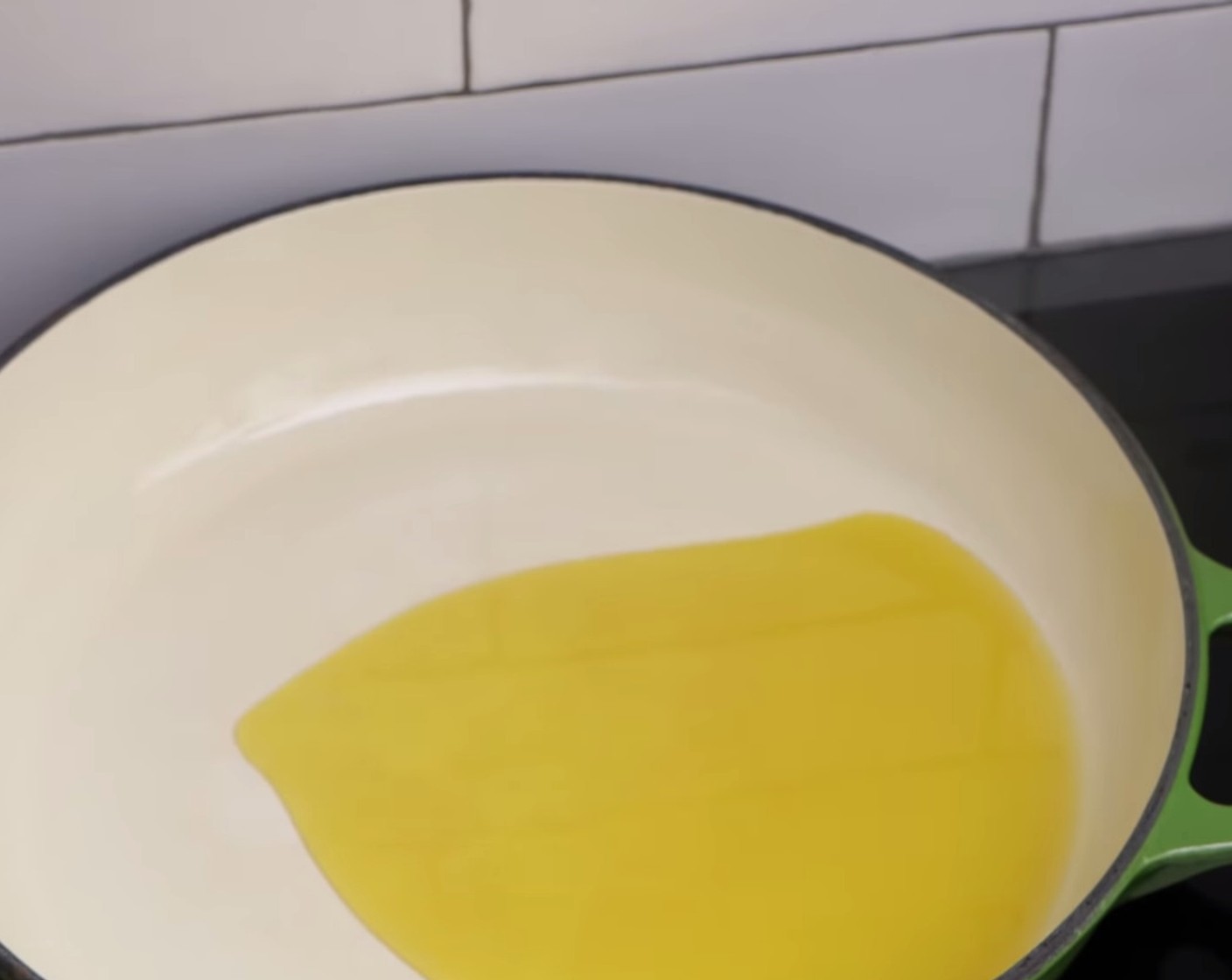 step 5 While the sauce is cooking, get a medium size fry pan and put it on the stove at medium heat before drizzling a generous amount of Extra-Virgin Olive Oil (as needed).