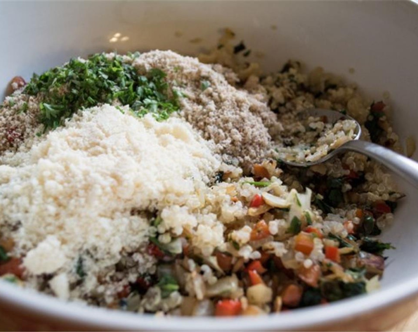 step 5 Add cooked quinoa to a large mixing bowl. Add in sautéed veggies and gently stir. In small bowl, mix Almond Meal (1/2 cup), Garlic Powder (1/2 tsp), Onion Powder (1/2 tsp) and Dried Oregano (1/2 tsp).