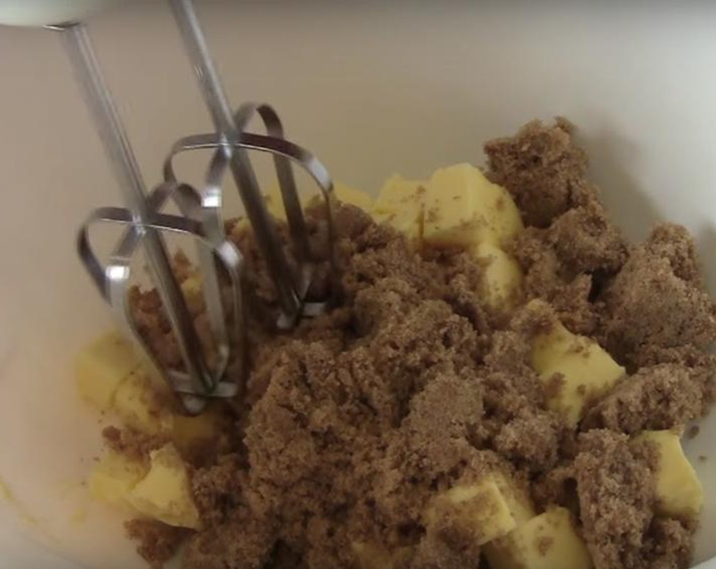 step 2 In a large mixing bowl, put Butter (6.5 oz) and Brown Sugar (1 cup). Beat them together with an electric mixer. Add in Eggs (3), beating the mix after adding each one. Then add in half of the Self-Rising Flour (2 cups) and Baking Powder (2 tsp) and mix them in. Mix in half of the coffee mixture. Mix in the other half of the flour and the remaining coffee mixture.