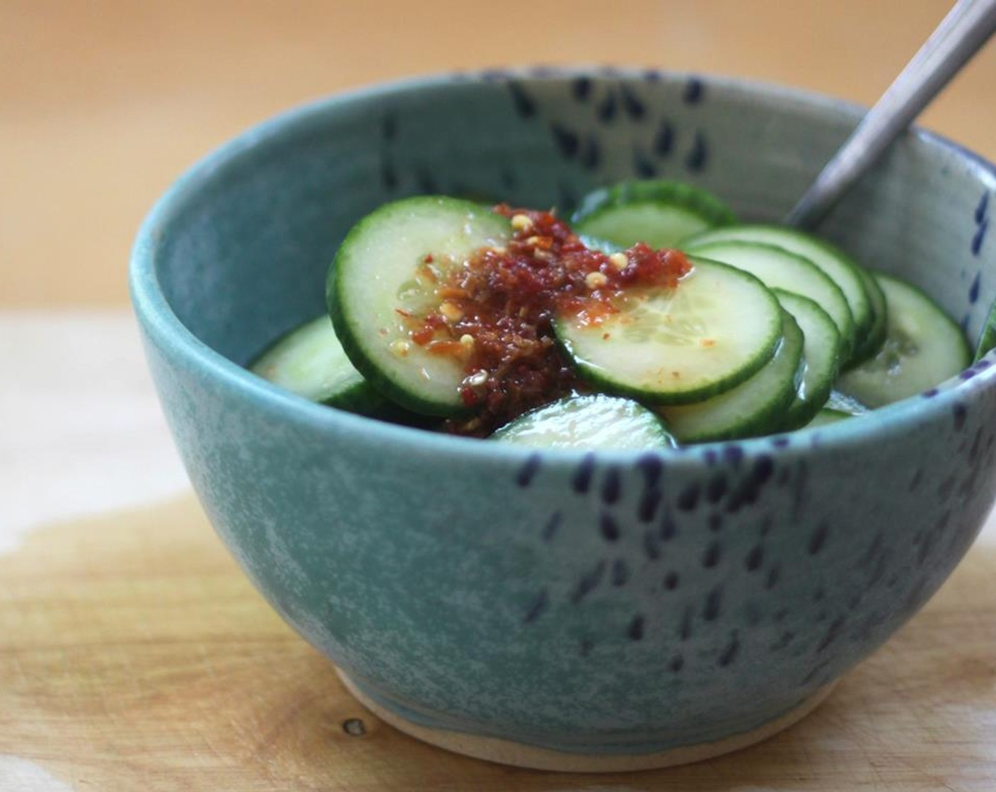 step 1 Pickle the cucumbers. In a large bowl whisk together the Sesame Oil (1 tsp), Rice Vinegar (4 Tbsp), Distilled White Vinegar (4 Tbsp), Honey (1 Tbsp), Sriracha (1 Tbsp). Add the English Cucumber (1) and let sit at least 30 minutes, but the longer the better.