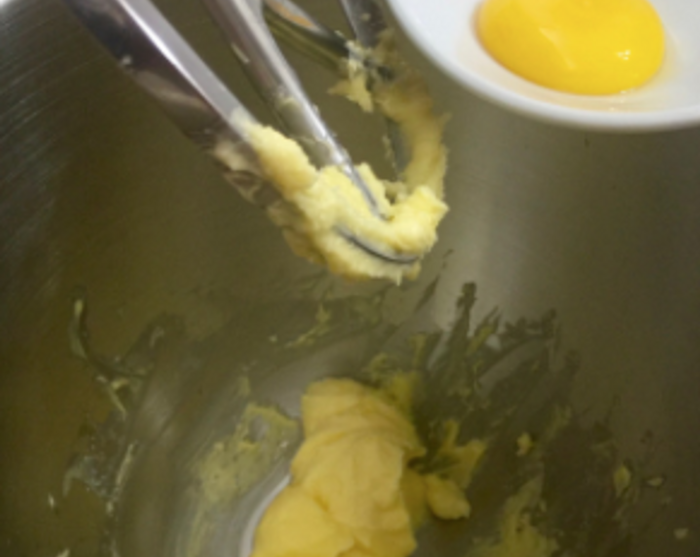 step 10 Next, add in the egg yolk.
