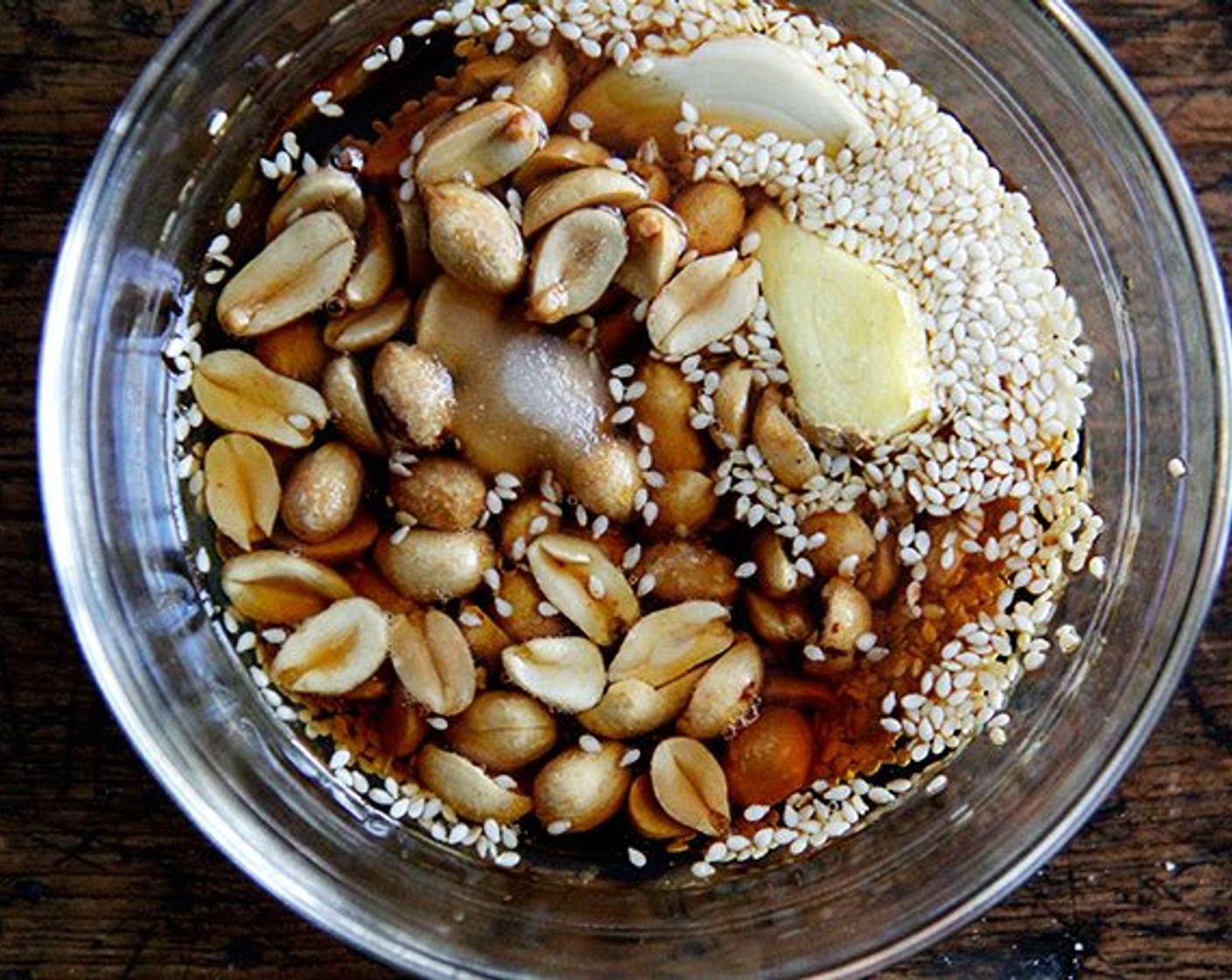 step 7 Meanwhile make the pesto: Pulse Sesame Seeds (1 Tbsp), Peanuts (4 Tbsp), Fresh Ginger (1 1/2 Tbsp), Garlic (1 clove), Soy Sauce (2 Tbsp), Sesame Oil (2 Tbsp), Rice Vinegar (1 Tbsp), Granulated Sugar (1/4 tsp) all together in a food processor until ground. Adjust the flavors to taste.