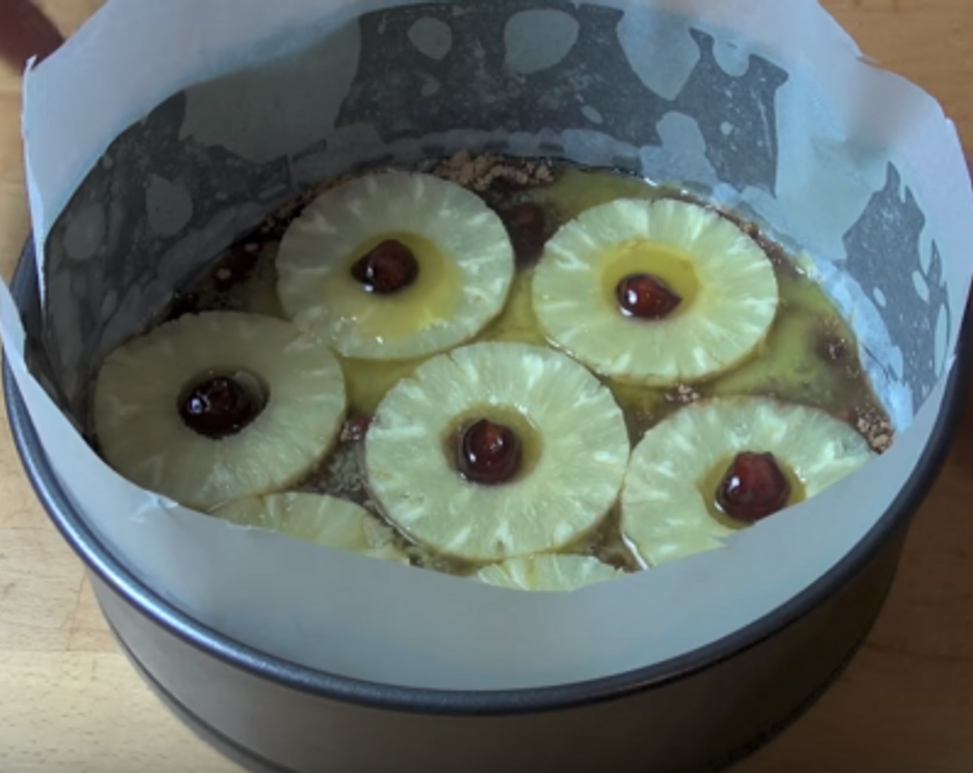 step 3 Drain Pineapple Rings (2 1/2 cups), then place one in the center of the base and the other six surrounding the center ring. If desired, put a Glace Cherries (as needed) in the center of each pineapple ring.
