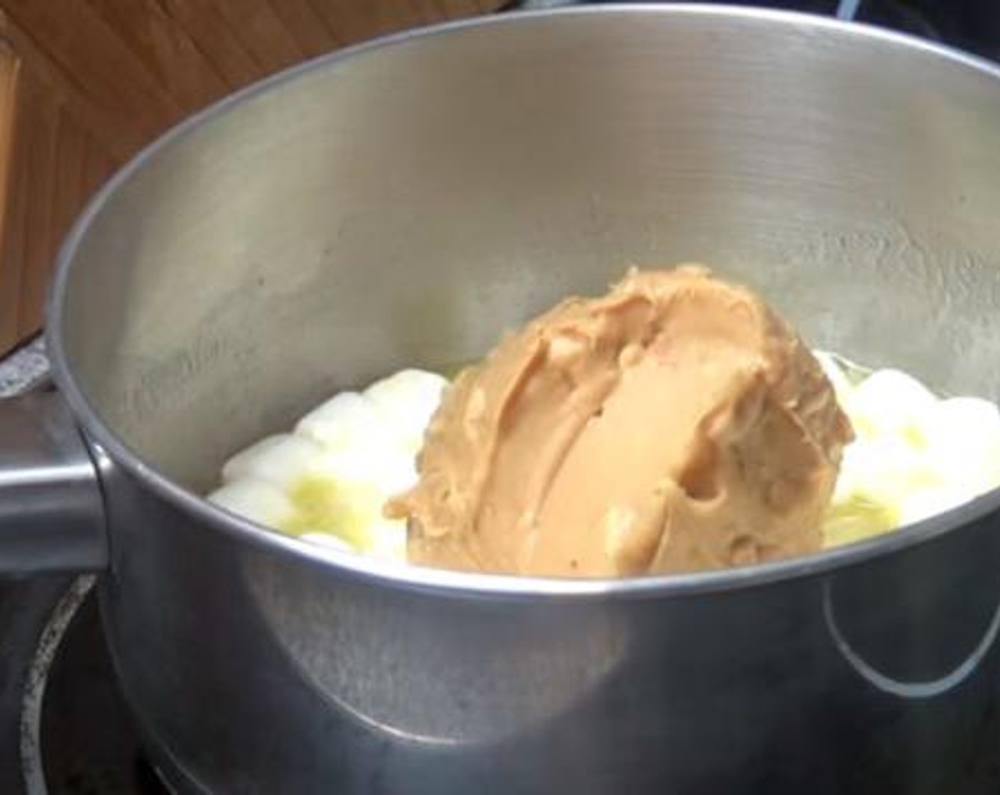 step 1 Into a small saucepan, melt together the Butter (3.5 oz), Mini Marshmallows (1/2 cup), and Crunchy Peanut Butter (1/2 cup).