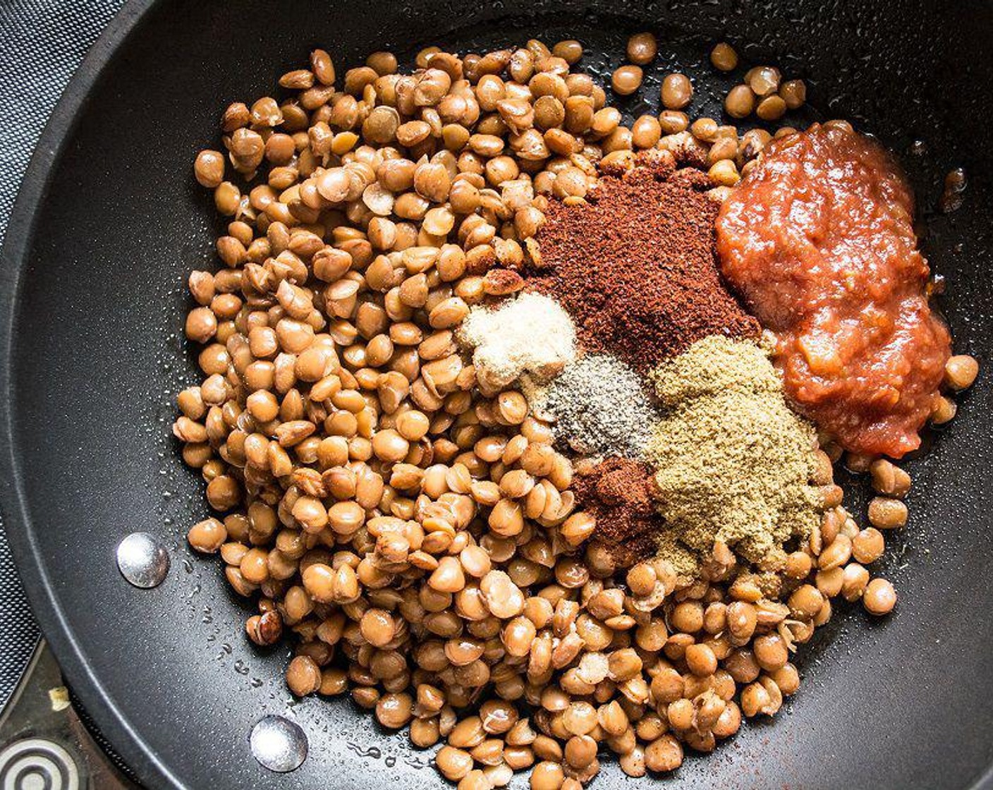 step 4 Meanwhile, add Lentils (1 can) to saute pan with Chili Powder (1 tsp), Ground Cumin (1 tsp), Ground Black Pepper (1/2 tsp), Sea Salt (1/4 tsp), Garlic Powder (1/4 tsp), Chipotle Chili Powder (1/8 tsp), and Salsa (2 Tbsp). Cook 5-7 minutes or until heated through. Stirring occasionally.