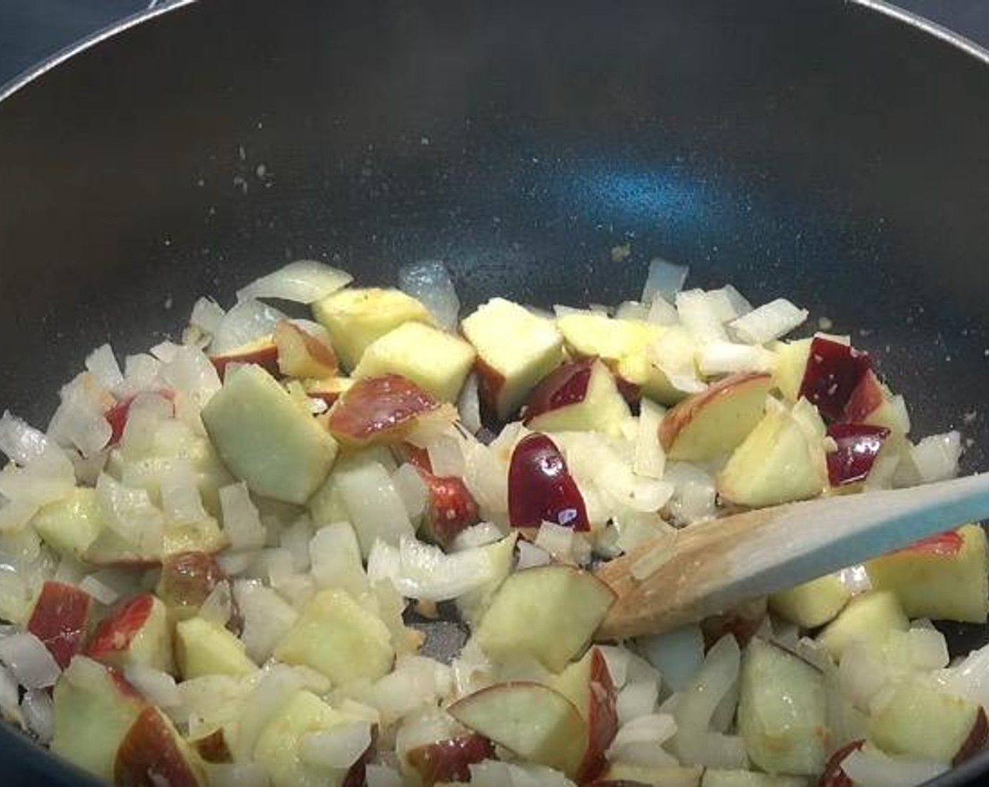 step 1 In a frying pan over medium heat, add Vegetable Oil (as needed), Yellow Onion (1), Red Apple (1), and Fresh Ginger (2 tsp). Cook for 7-8 minutes, or until the onions and apples have softened.