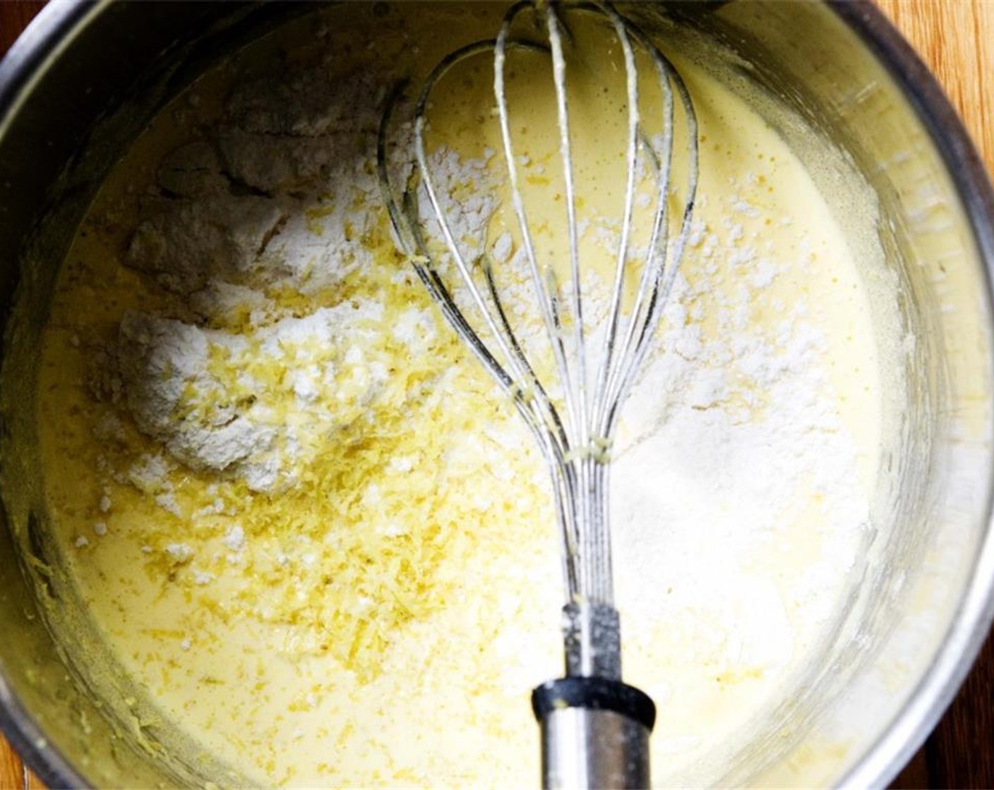 step 2 Add All-Purpose Flour (4 Tbsp) and the zest from Lemon (1) and mix until smooth.