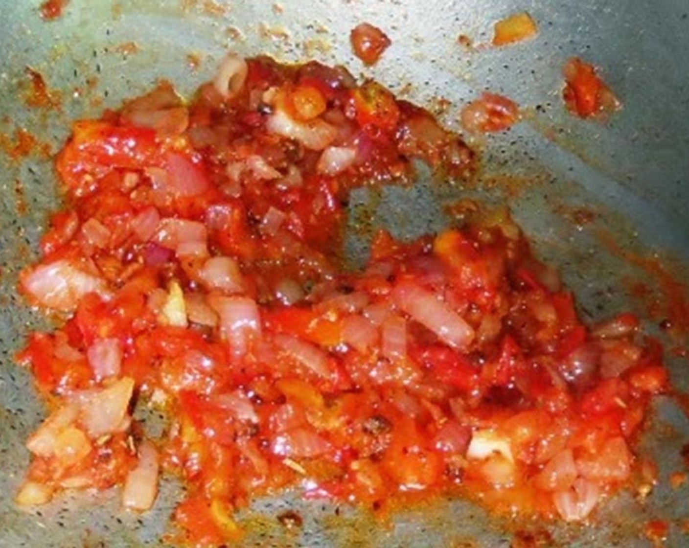 step 5 Once the tomato reduces to a mush, season with Salt (to taste) and Freshly Ground Black Pepper (2 tsp). Add Tomato Paste (2 tsp) and Dried Oregano (2 tsp). Mix well and let it cook for another 2-3 minutes.