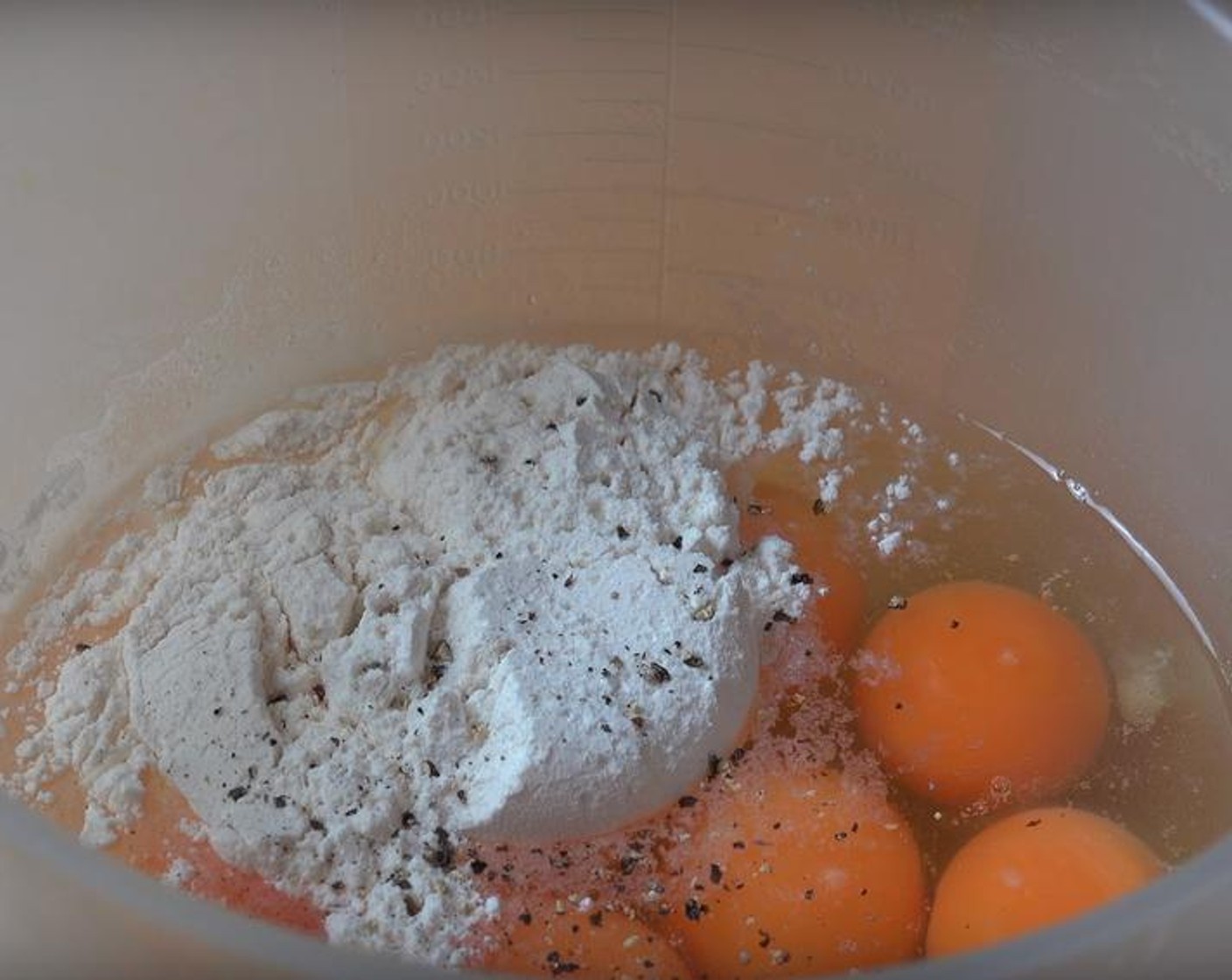 step 3 Put Eggs (10) in a large mixing jug. Add Self-Rising Flour (4 Tbsp), Salt (to taste), and Ground Black Pepper (to taste). Stir the mix with a whisk until it's smooth.