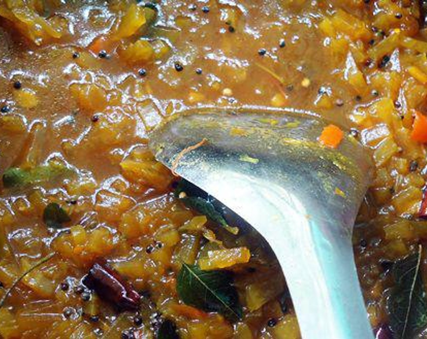 step 1 Melt Jaggery (2 pieces) in half a cup of water and filter it. Melt Tamarind Paste (1/2 cup) in water. Add melted jaggery to tamarind water and boil with Green Chili Peppers (3) and Fresh Ginger (1/2 tsp).