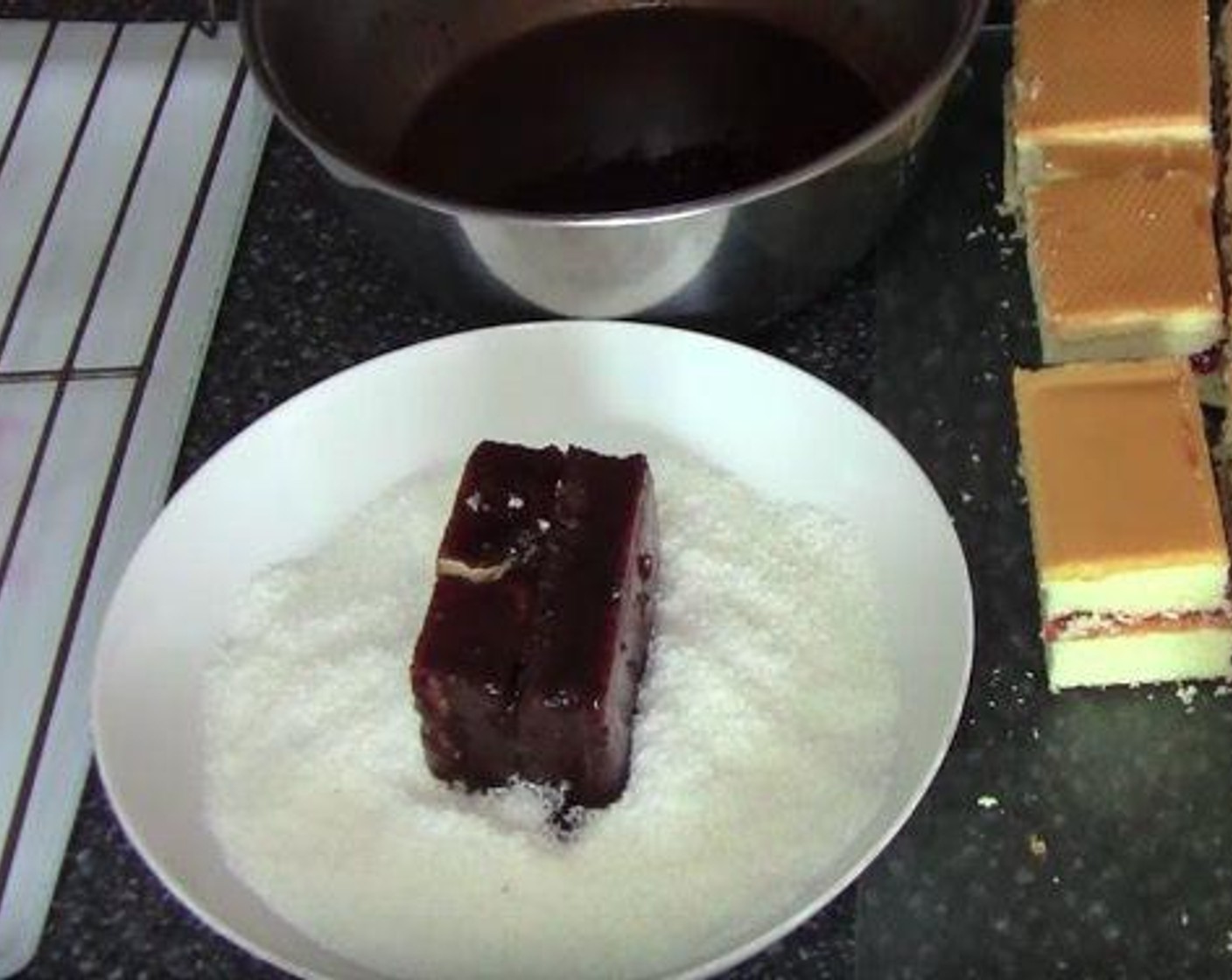 step 3 Use a fork to pick up one cake and get it coated with the chocolate icing, and drip of the excess. Then place it into the Unsweetened Shredded Coconut (2 cups) and cover it with coconut. Place the cake on a rack. Continue with the rest. Serve and enjoy!