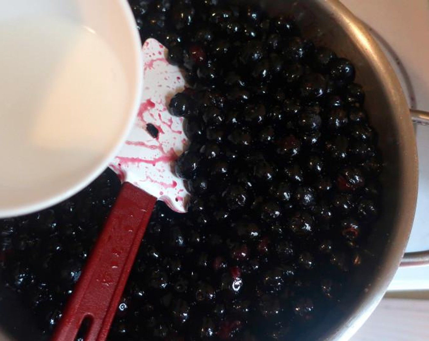 step 4 Melt Butter (1 stick) add washed and dried Fresh Blueberries (4 cups), when simmering, add Corn Starch (1 tsp) and Water (2 tsp) mixed to make a cornstarch slurry, simmer a few more seconds, remove from heat.
