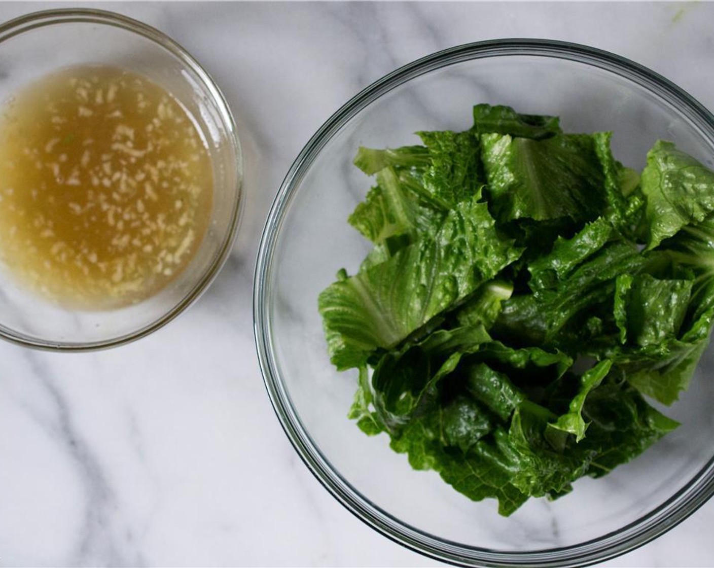 step 5 Just before you’re ready to cook the tuna burgers, make the dressing. In a medium-sized bowl, combine Limes (2), Fish Sauce (1 Tbsp), Orange (1/4), Rice Vinegar (2 tsp), and Garlic (1 clove). Stir well.
