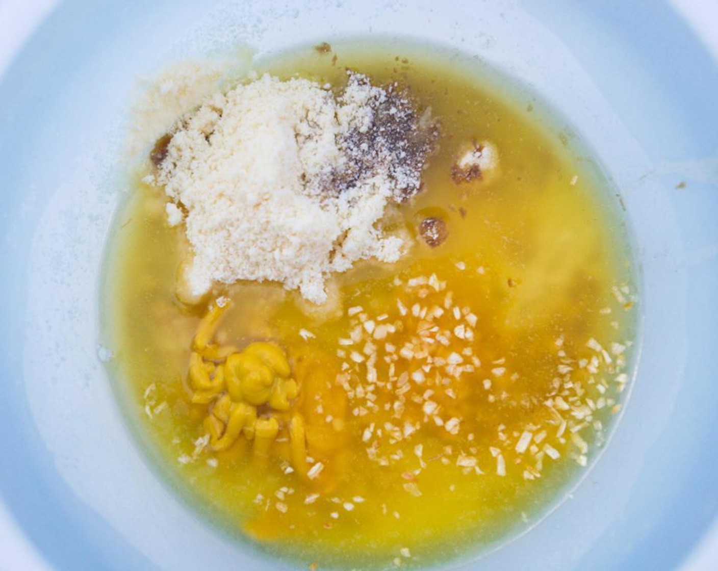 step 6 In a medium bowl, combine the Butter (1/2 cup), Yellow Mustard (1 Tbsp), Worcestershire Sauce (1 Tbsp), Dried Onions (2 Tbsp), and Parmesan Cheese (4 Tbsp).