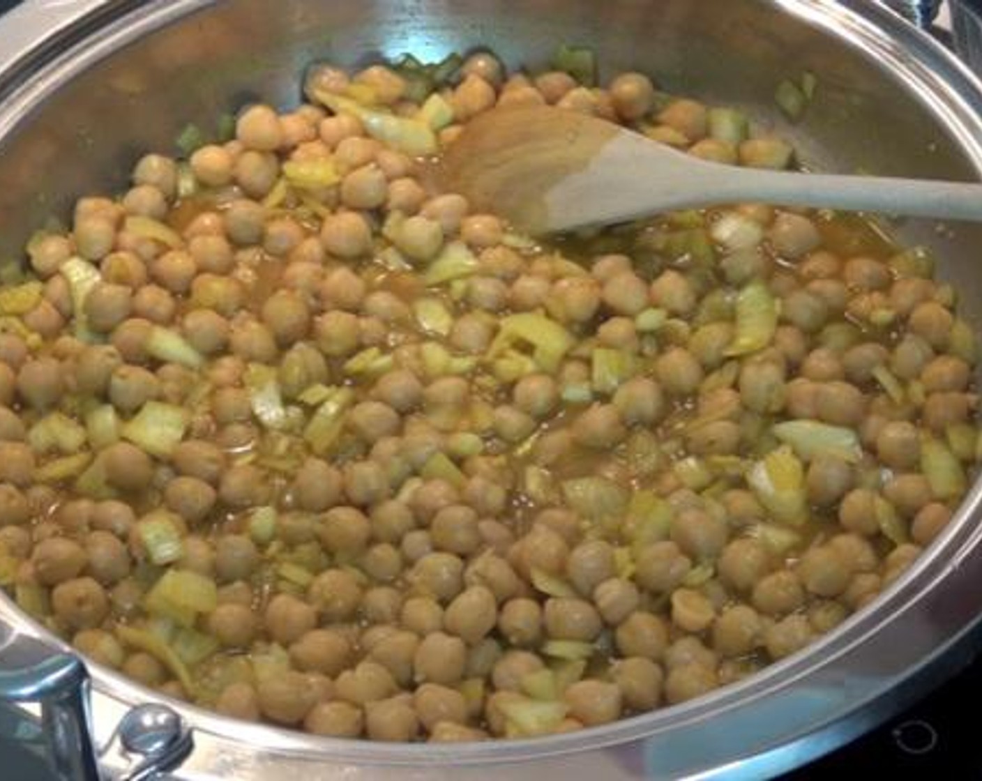 step 2 Next add the Ground Ginger (1 tsp), Curry Powder (1 1/3 Tbsp), Chickpeas (2 cans), Ground Cumin (1 tsp), and Water (1 cup).