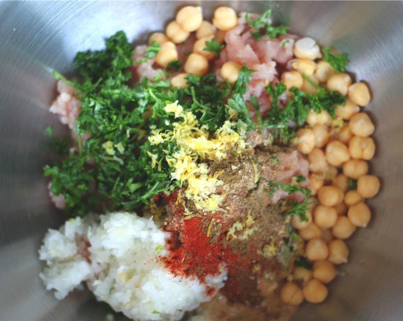 step 1 Mix together the Ground Turkey (1 lb), Canned Chickpeas (1 cup), Onion (1/2), Garlic (4 cloves), Fresh Parsley (4 Tbsp), Tahini (2 Tbsp), Ground Cumin (1 tsp), Ground Coriander (1 tsp), Paprika (1/2 tsp), Ground Ginger (1/2 tsp), Cayenne Pepper (1/4 tsp), Ground Allspice (1/4 tsp), Ground Cinnamon (1/8 tsp), and zest from Lemon (1/8).