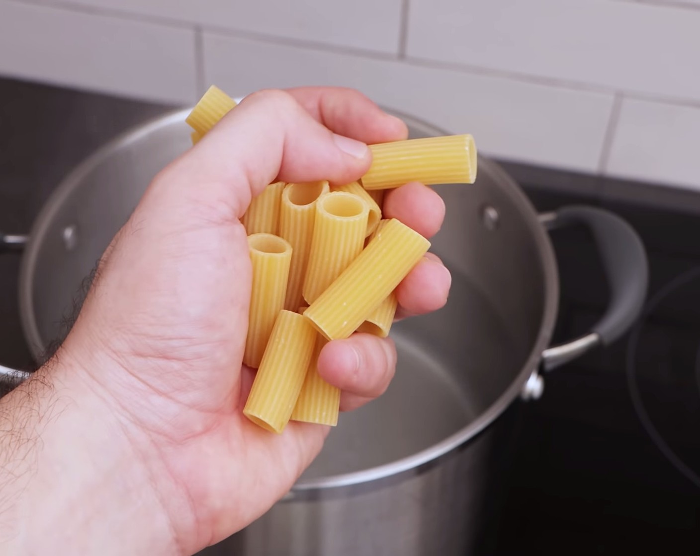 step 13 Once the eggs are ready, add a handful of Rock Salt (as needed) to your pot of boiling water, start cooking the Rigatoni (1.1 lb), and check the packet instructions for the cooking time.