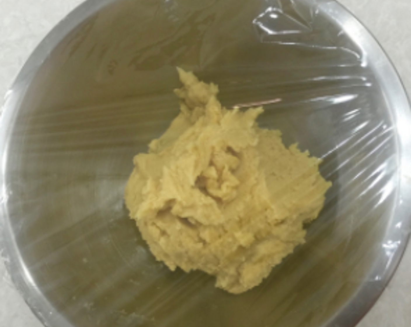 step 14 Then, as this batter is quite soft, put the cookie dough in a bowl, cover with cling wrap and chill in refrigerator for about half an hour. (Just to get it firm enough to roll easily).