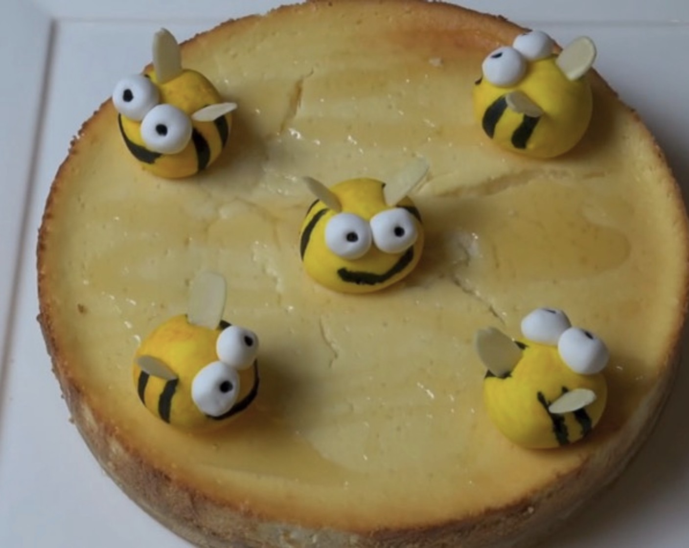 step 11 Drizzle cheesecake with Honey (to taste) and top with fondant bees. Serve and enjoy!