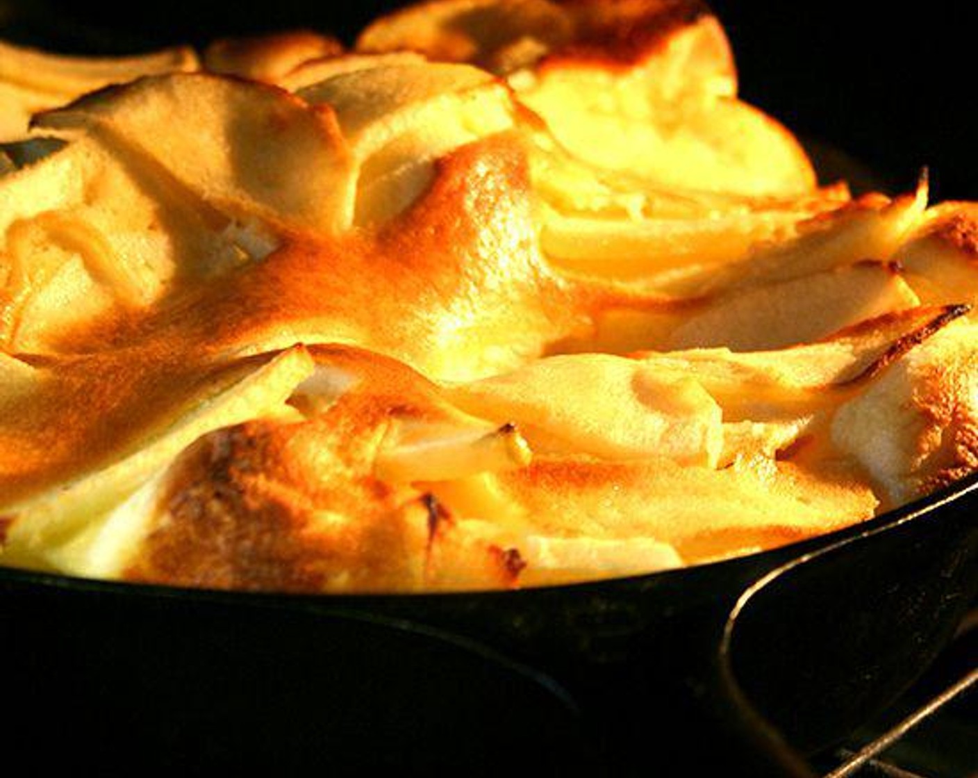 step 3 While apple is cooking, add Whole Milk (1/2 cup), All-Purpose Flour (1/2 cup), Large Eggs (4), Granulated Sugar (3 Tbsp), Vanilla Extract (1/2 tsp), and Salt (1/4 tsp) to butter in blender and blend until smooth.
