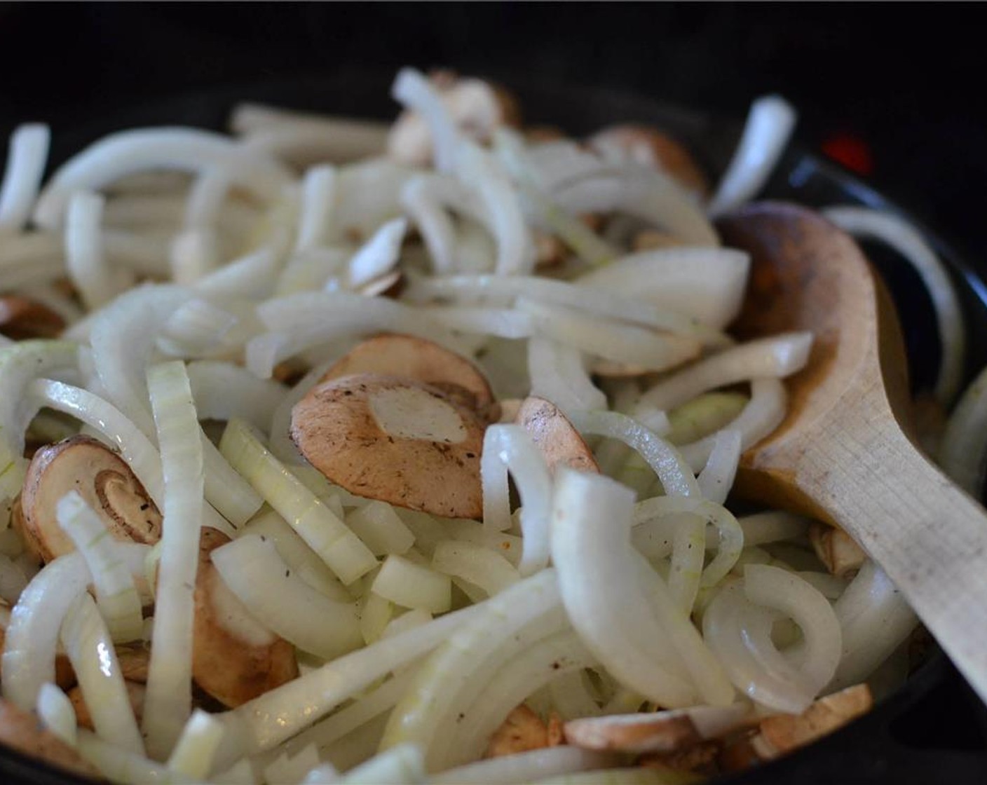 step 6 Once the butter is melted, add Yellow Onions (2) and Mushrooms (2 1/4 cups) and toss to coat. Let cook, untouched for 5 to 7 minutes. Toss.