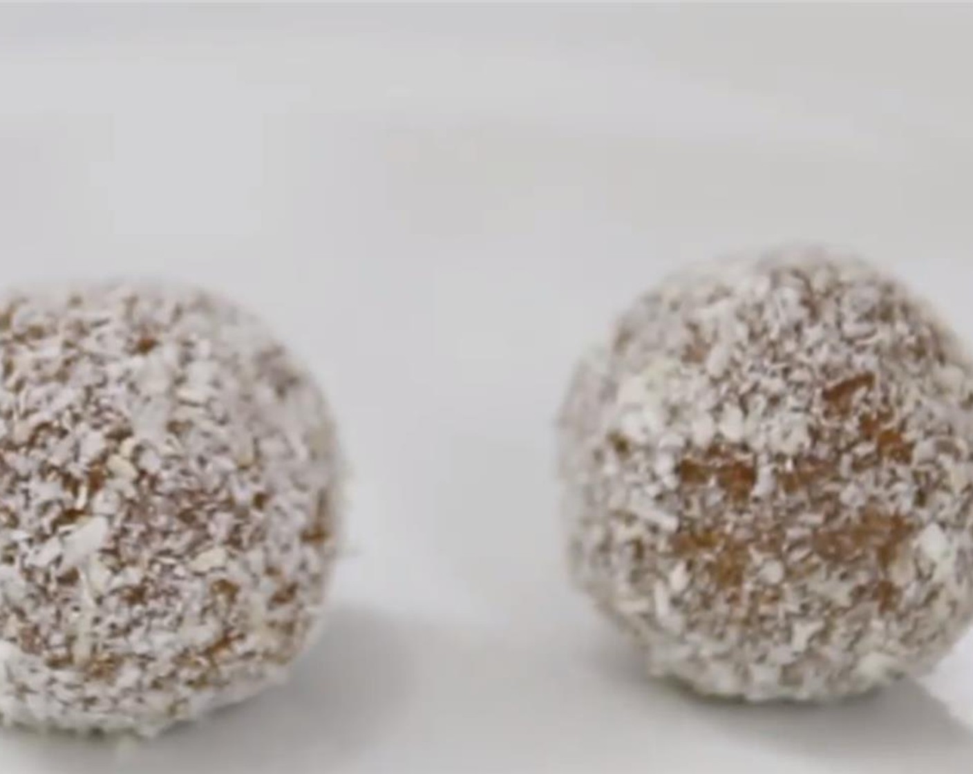 step 4 Push down on the center and fold the edges over the top of the chips. Roll it back into a ball again and roll it in the Unsweetened Coconut Flakes (4 Tbsp).