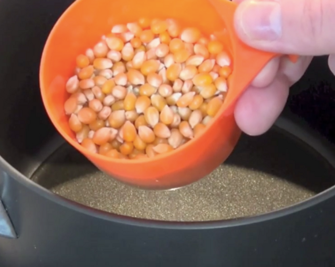 step 3 Add in the rest of our kernels and place on the cover.