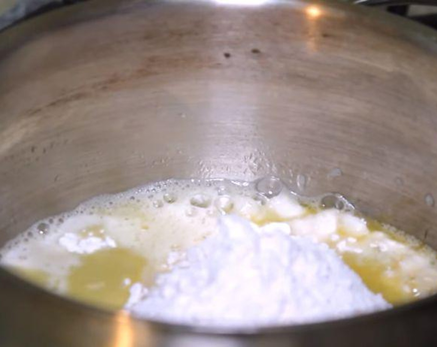 step 1 Put a saucepan over medium heat. Add the Water (1 cup), Butter (1 oz), Salt (1/2 tsp), and Granulated Sugar (1 Tbsp). Let the water come to a boil. Add the All-Purpose Flour (1 cup) and turn the heat to low. Whisk everything together.