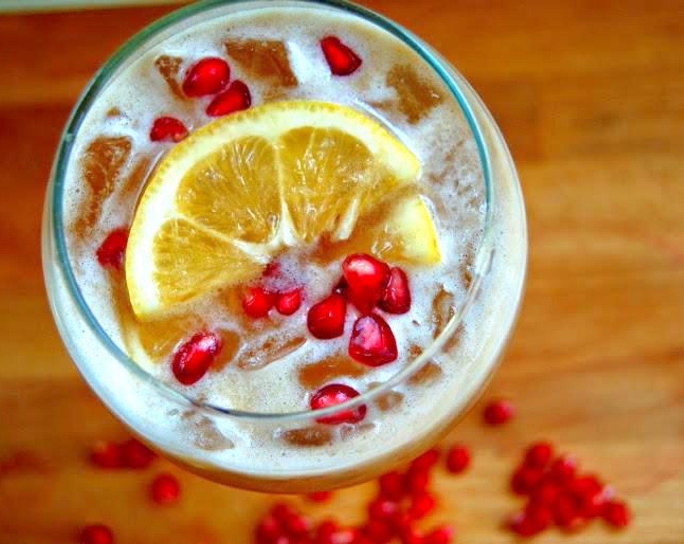 step 2 Add Ice (to taste) and fill with Club Soda (to taste). Garnish with a slice of lemon and Pomegranate Seeds (to taste).