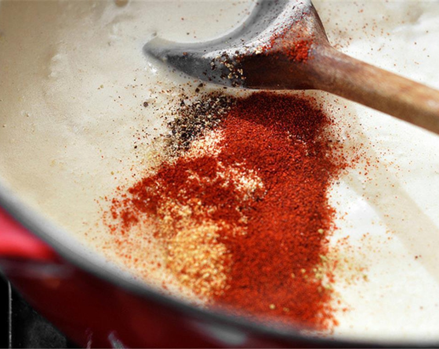 step 5 Once thickened, season with the Dijon Mustard (1 Tbsp), Salt (1 tsp), Freshly Ground Black Pepper (1 tsp), Dried Thyme (1/2 tsp), Onion Powder (1/2 tsp), Garlic Powder (1/2 tsp), and Paprika (1/2 tsp).