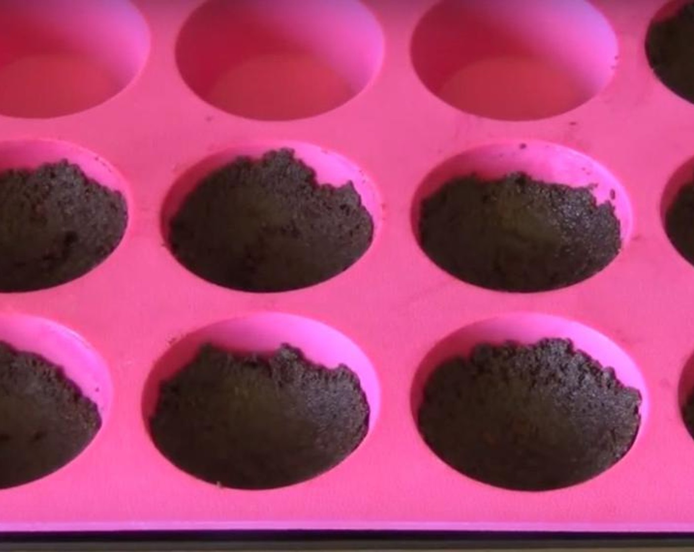 step 1 Crush Graham Crackers (3 cups) with a food processor and put it in a bowl. Melt Butter (7 oz) and mix it with the crumbs. Divide the mixture in a non-stick muffin tray. Press them down with a spoon. Put the tray into the fridge for half an hour.