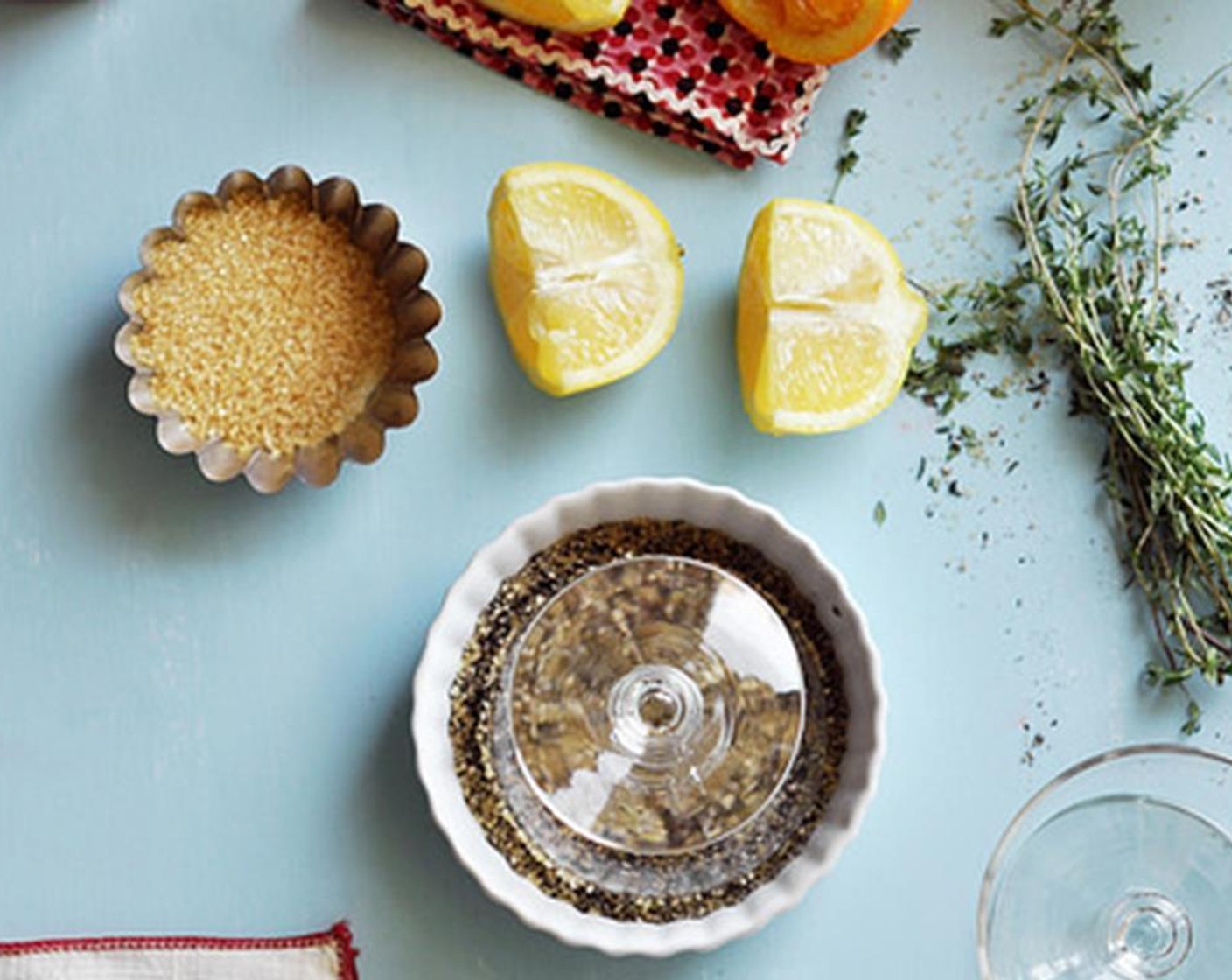 step 4 Combine the Ground Black Pepper (4 Tbsp) and Raw Sugar (4 Tbsp) in a shallow dish. Cut wedges out of the Lemon (1) Rub the lemon wedge along the edge of the glasses to create a glue. Then dip the glass, upside-down into the shallow dish.