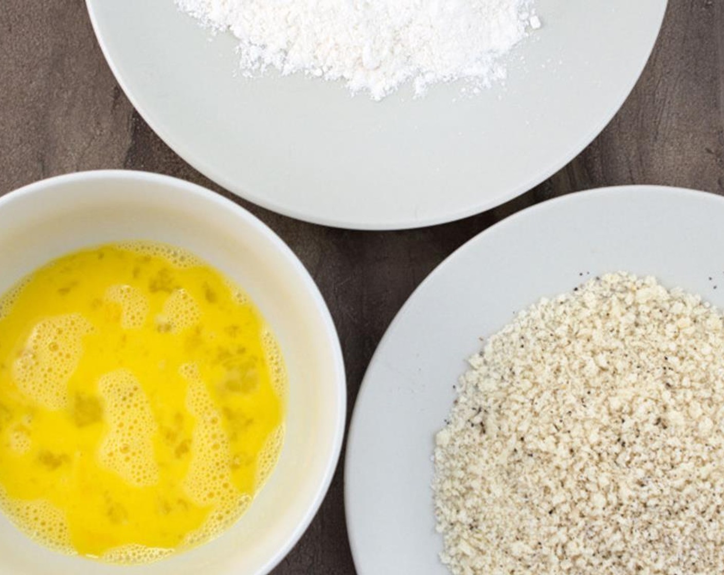 step 2 Begin by lining up a plate with All-Purpose Flour (4 Tbsp), a bowl with the beaten Egg (1), and a plate with the Panko Breadcrumbs (3/4 cup).