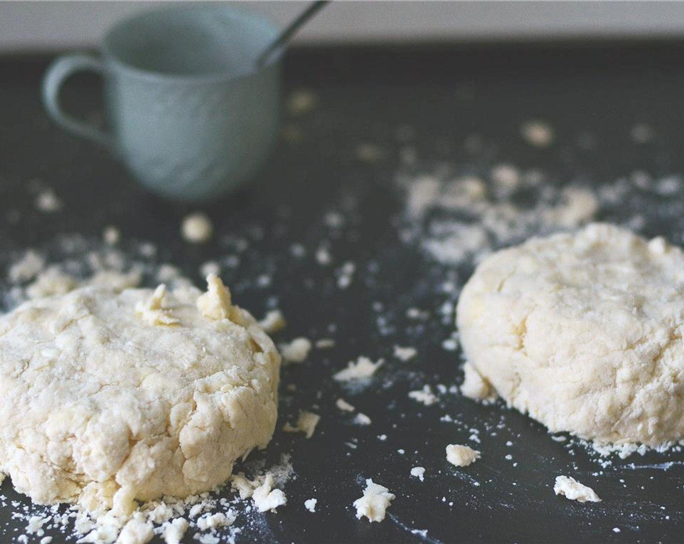 step 5 Empty contents out onto a lightly floured surface and divide into two even pieces. Knead dough just a few times to form a shaggy ball of dough.